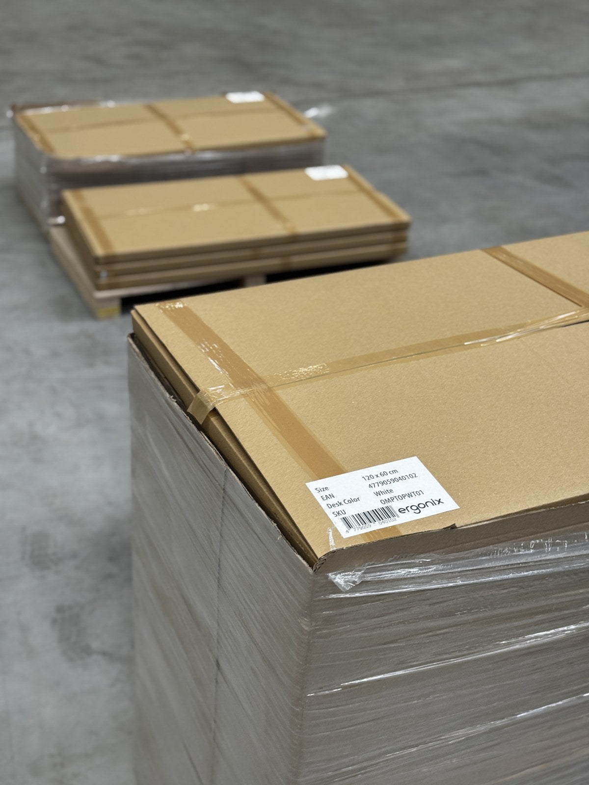 Packed Ergonix tabletops with a size and colour label