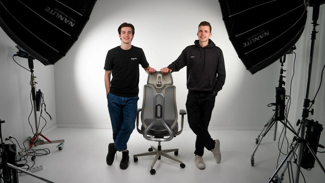 Gustas Smulkstys and Lukas Grigalis, the founders of Ergonix, with an OmniSit Pro chair
